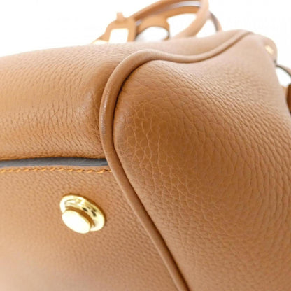 Louis Vuitton Others Gold Handbags