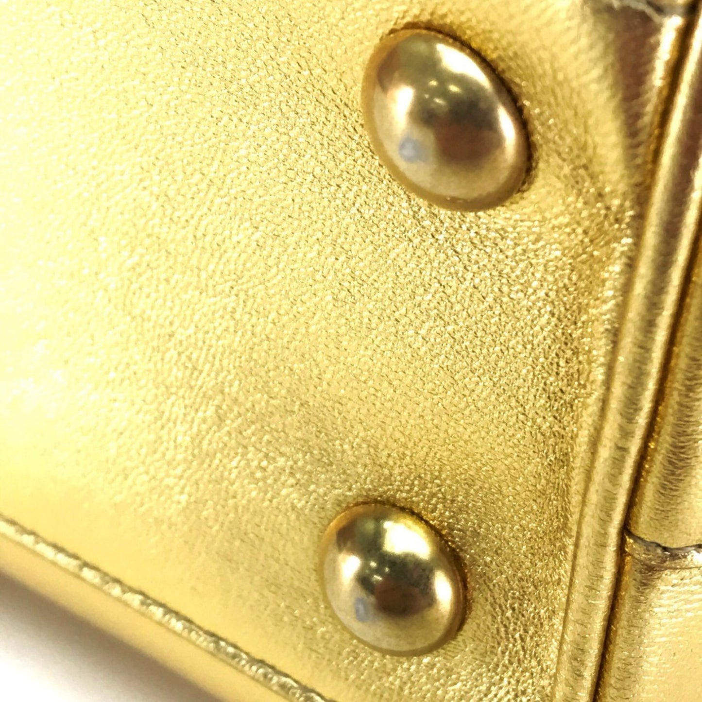 Saint Laurent Others Gold Handbags
