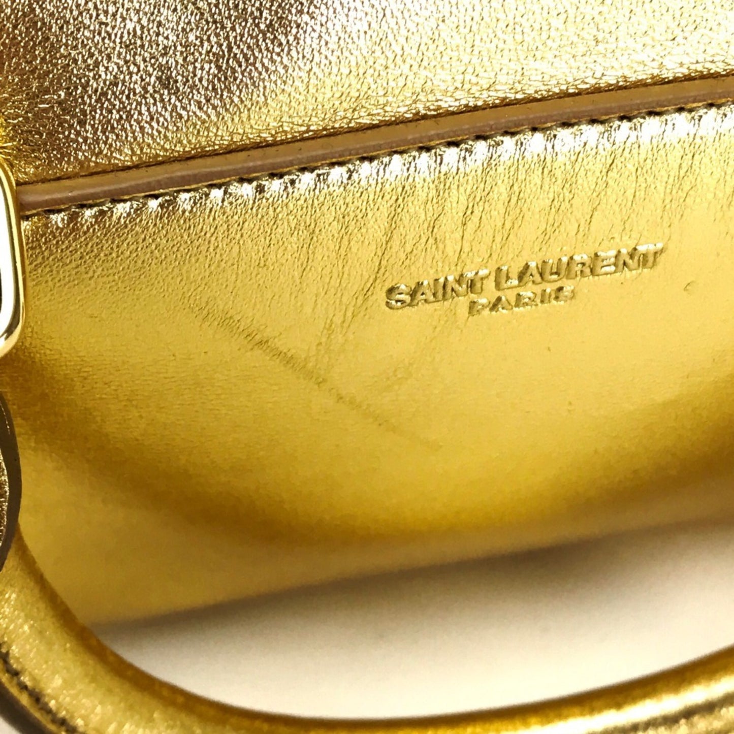 Saint Laurent Others Gold Handbags