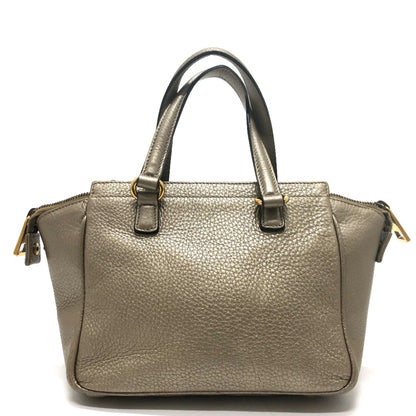 Gucci Others Gold Handbags
