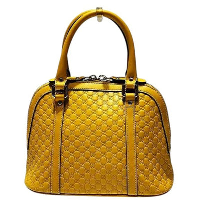 Gucci Others Yellow Handbags