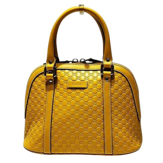 Gucci Others Yellow Handbags