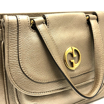 Gucci Others Gold Handbags