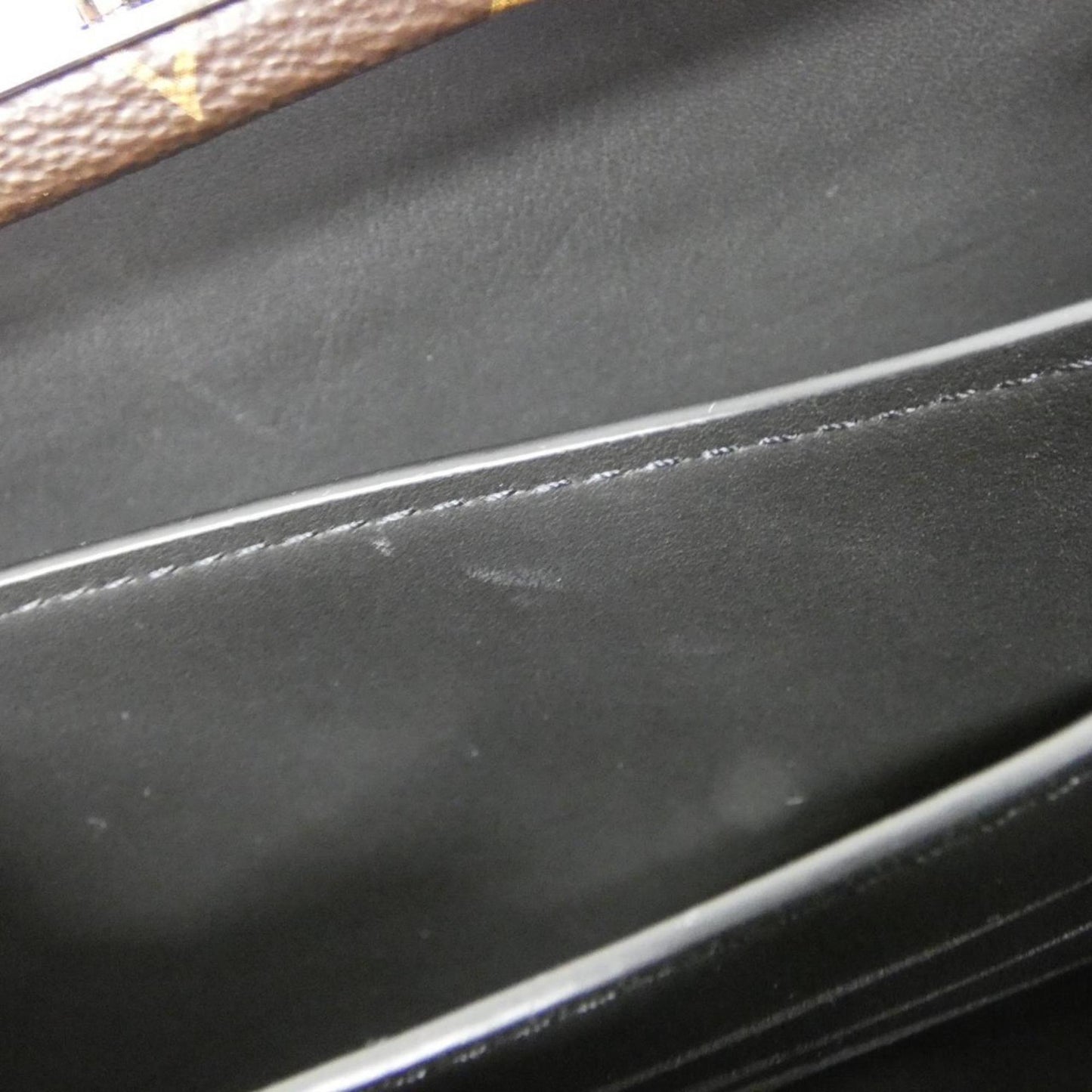 Louis Vuitton Coated Canvas Brown Clutch Bags