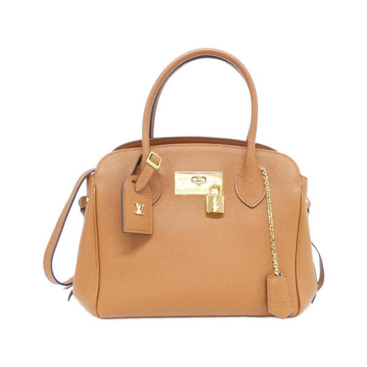 Louis Vuitton Others Gold Handbags