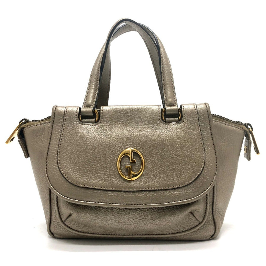 Gucci Others Gold Handbags