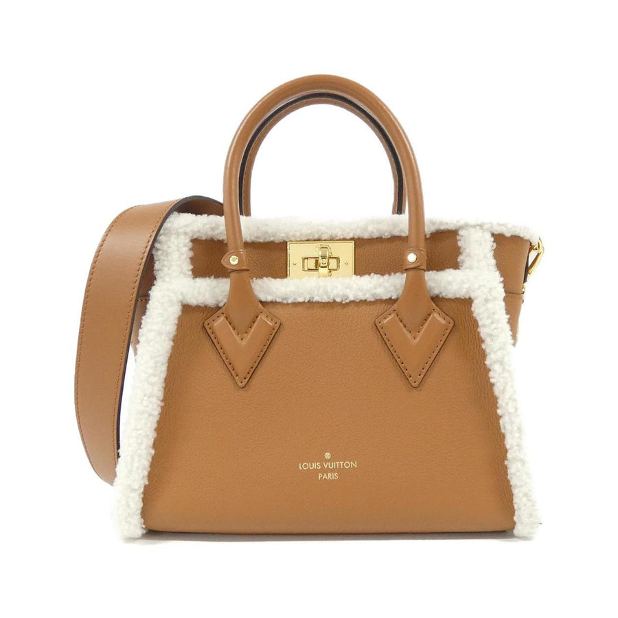 Louis Vuitton Gold Leather On My Side