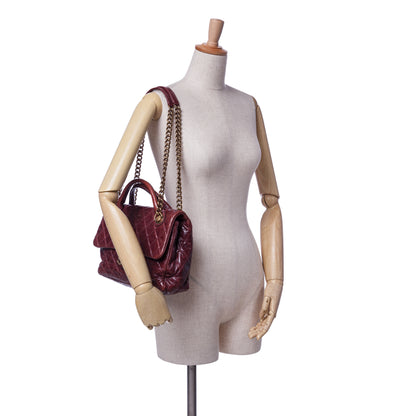 Chanel Medium Glazed Calfskin Castle Rock Top Handle Flap