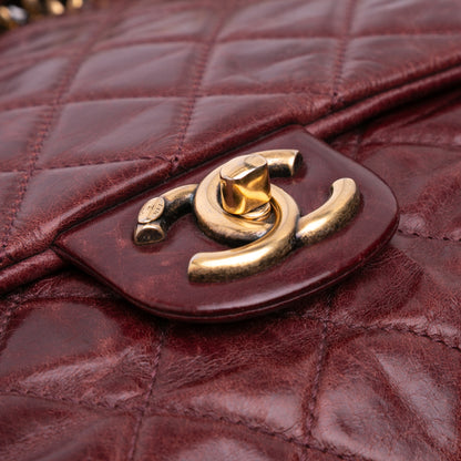 Chanel Medium Glazed Calfskin Castle Rock Top Handle Flap