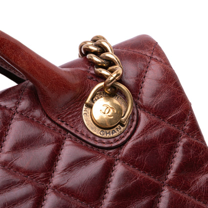 Chanel Medium Glazed Calfskin Castle Rock Top Handle Flap